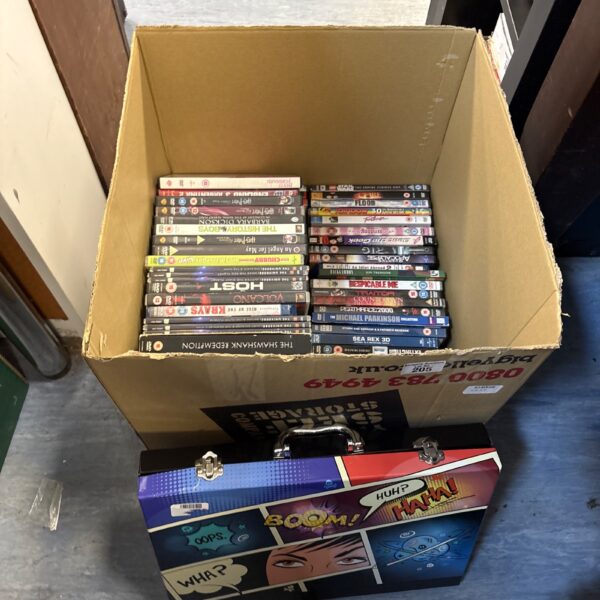 Large box filled with a mixed lot of DVDs for home entertainment.