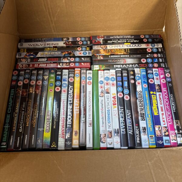 Mixed DVD lot with various movie titles visible.