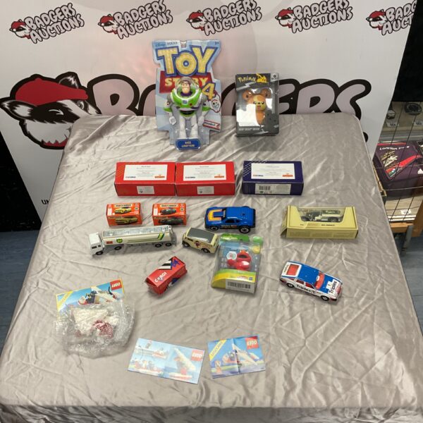 Mixed toy lot featuring Toy Story, Corgi, and Matchbox collectibles.