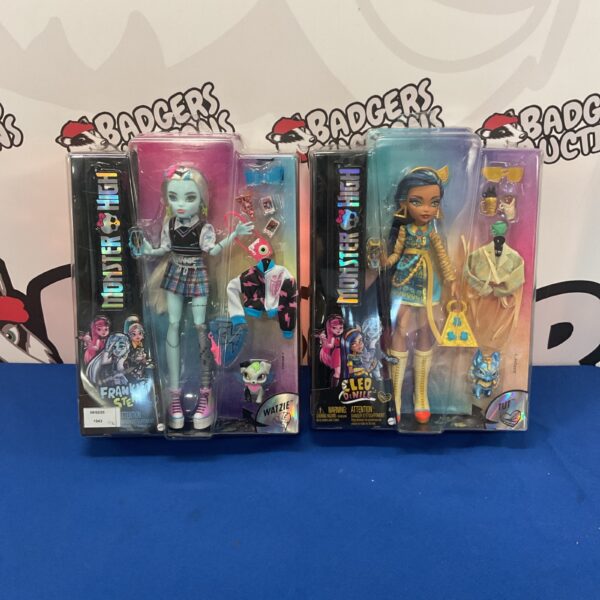 Monster High dolls Frankie Stein and Cleo DeNile, collectible fashion dolls.