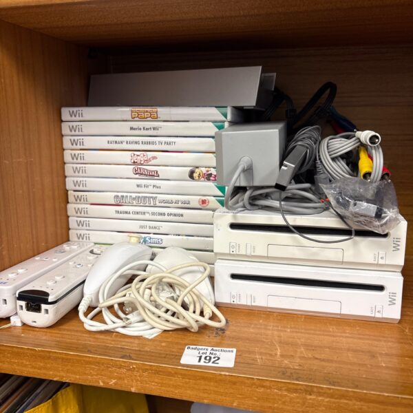 Nintendo Wii consoles lot with games and accessories.