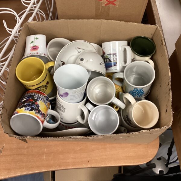 Mixed lot of colourful novelty mugs including Mr. Men and Transformers designs.