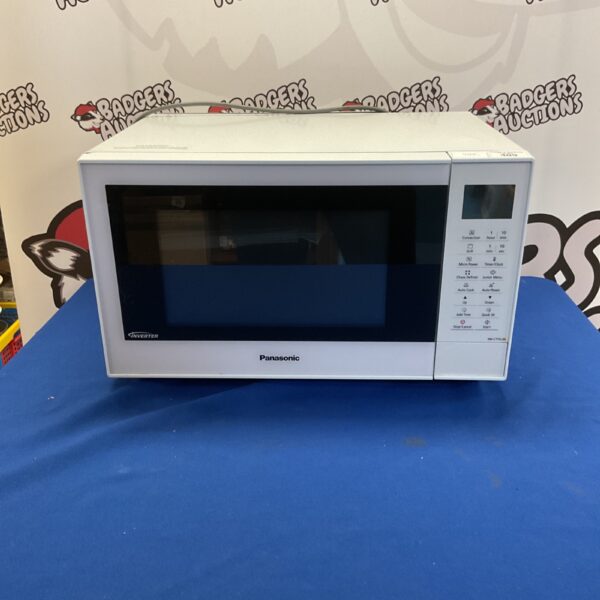 Stainless steel Panasonic NN-CT55JW microwave oven on a countertop.