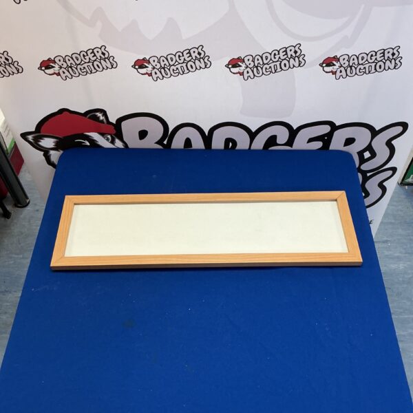 Rustic pine photo frame for displaying cherished memories.