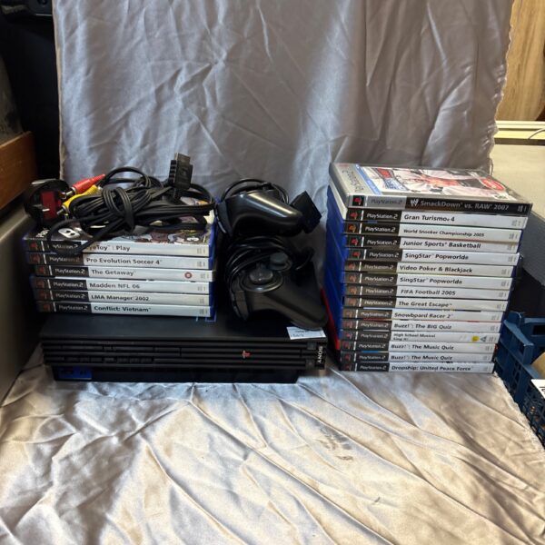 PlayStation 2 console bundle with games and controllers.