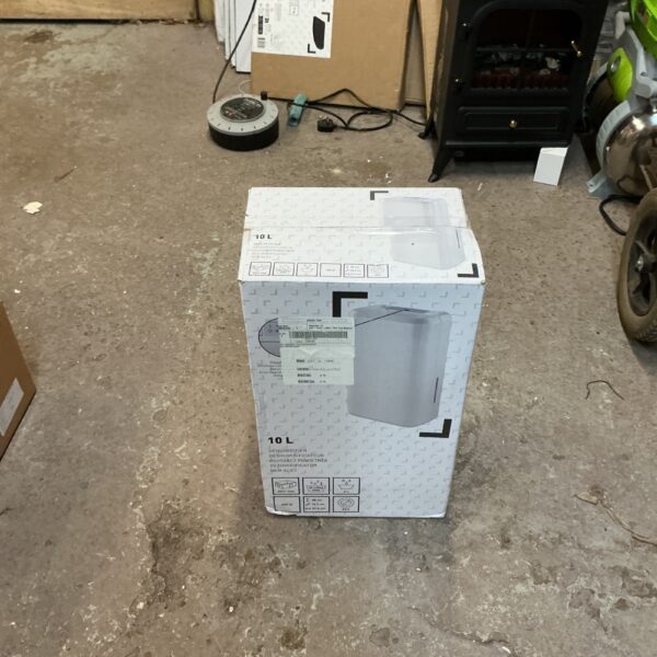 Boxed portable dehumidifier unit for moisture removal.