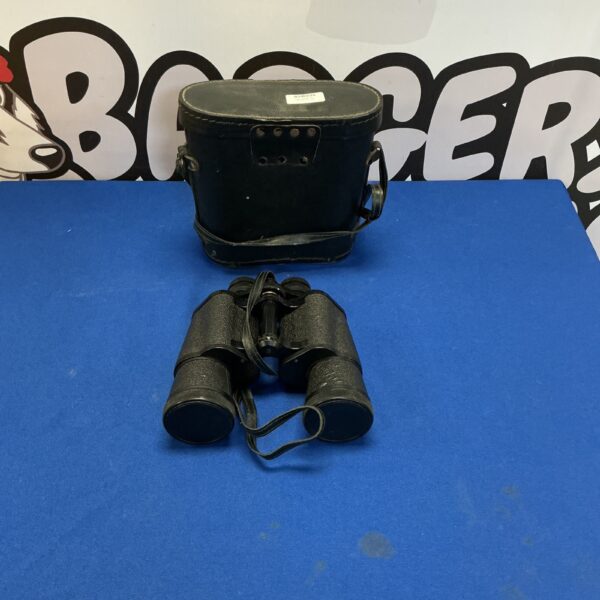 Vintage Prinz 10x50 binoculars with a worn leather case.