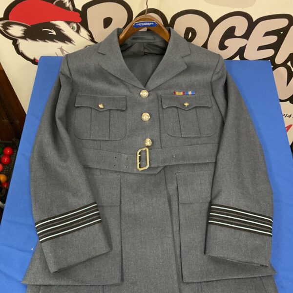 Front view of a vintage RAF Wing Commander uniform jacket.