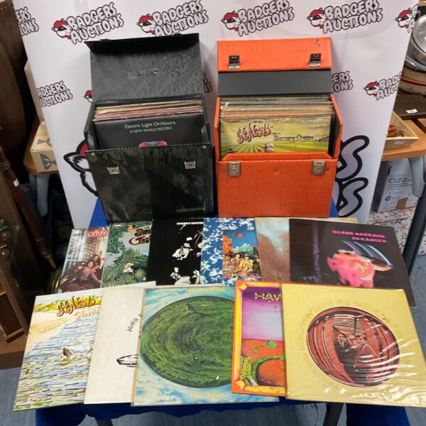 Rock vinyl record collection with Pink Floyd and Black Sabbath albums.