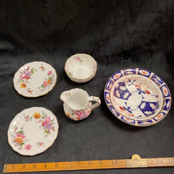 Vintage Royal Crown Derby porcelain set with floral design.