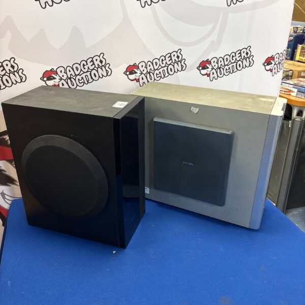 Black Samsung and grey Phillips subwoofer speaker system.