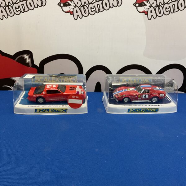 Vintage Scalextric Chevrolet Camaro and Corvette model racing cars.