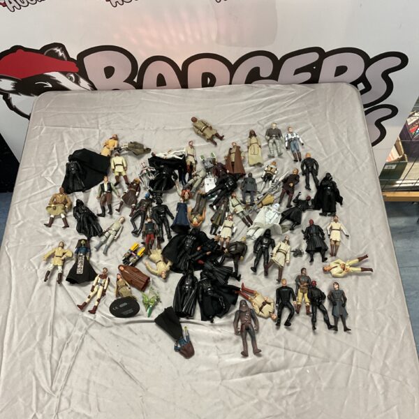 A lot of vintage Star Wars action figures including Darth Vader.