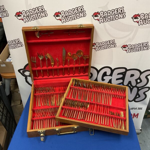 Large Thai bronzed cutlery set displayed in a wooden case.