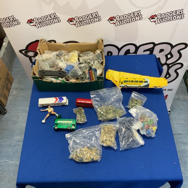 Vintage toy soldiers and model buses in a mixed lot for collectors.