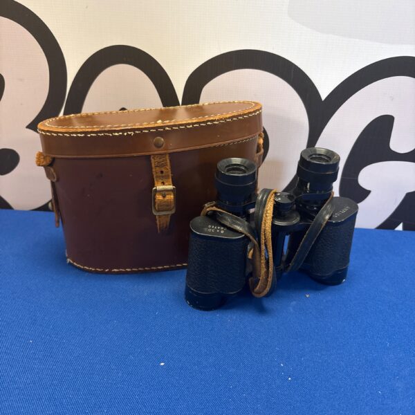 Vintage Amplion 8x30 binoculars in a leather case, collectible optics.