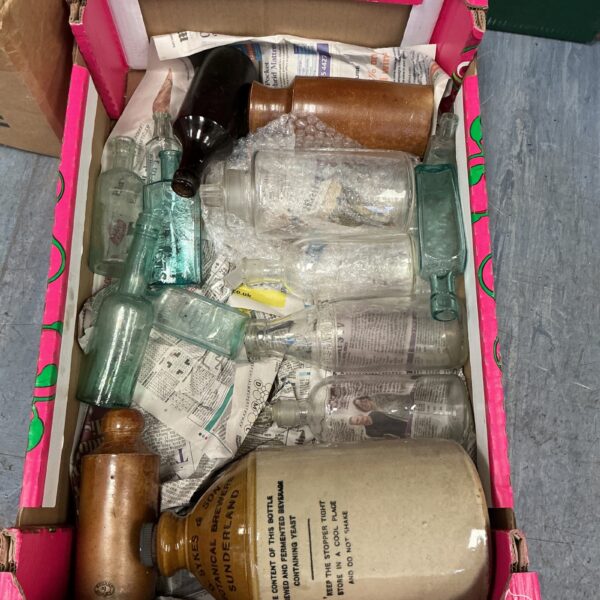 Vintage bottle collection with a flagon and assorted glass bottles.