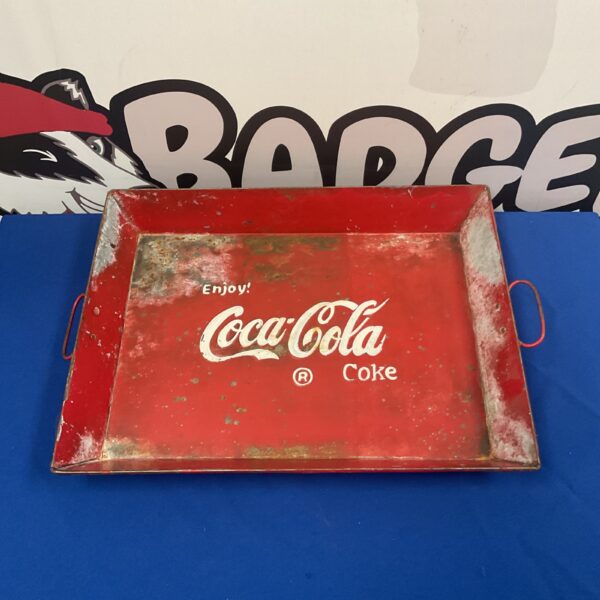 Vintage Coca-Cola tin serving tray with classic advertising design.