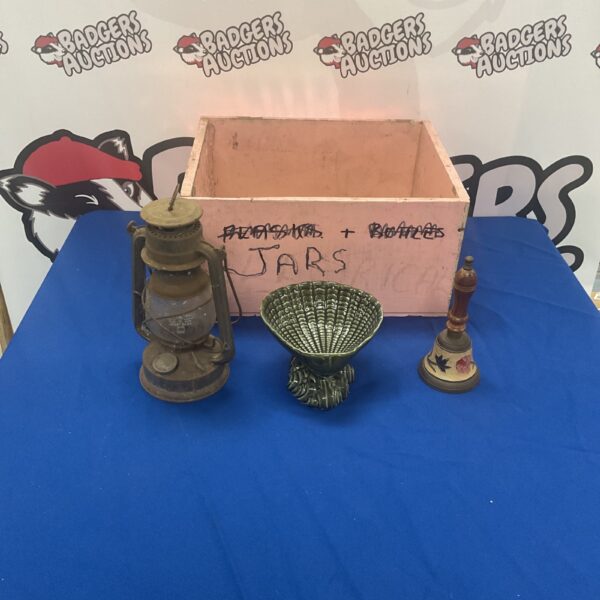 Vintage collectible lot with lantern, bell, and shell bowl.