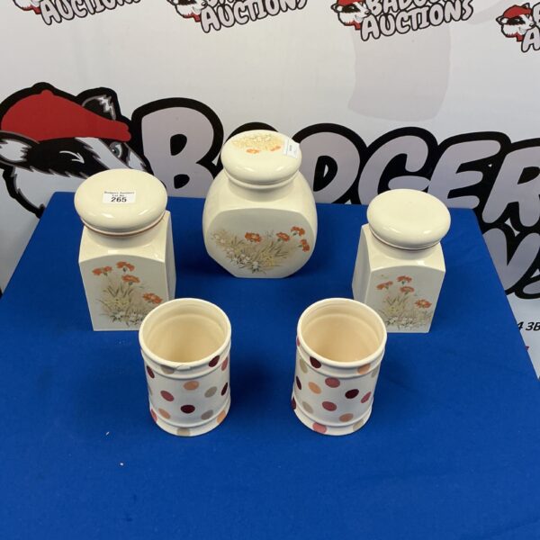 Vintage ceramic kitchen storage containers with floral design.