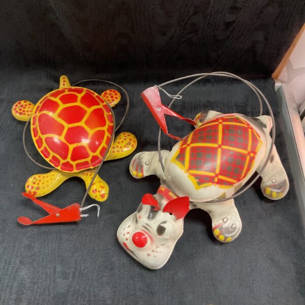 Vintage Mobo tinplate toys, including a tortoise and Scottie dog.