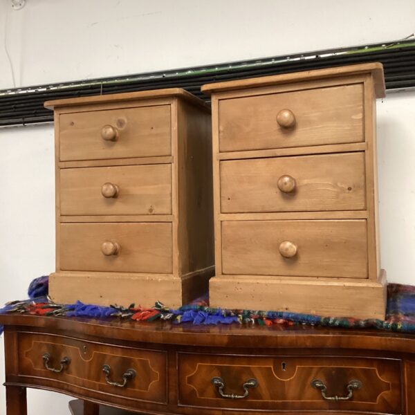 Pair of vintage pine bedside cabinets with open shelving.