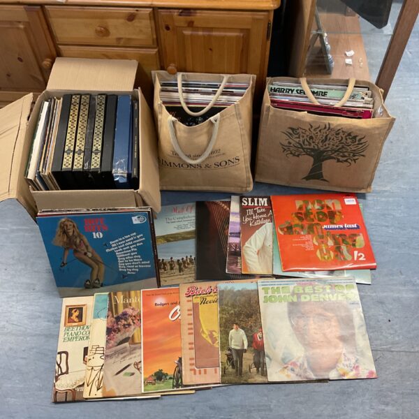 Large lot of vintage vinyl records for collectors and music lovers.