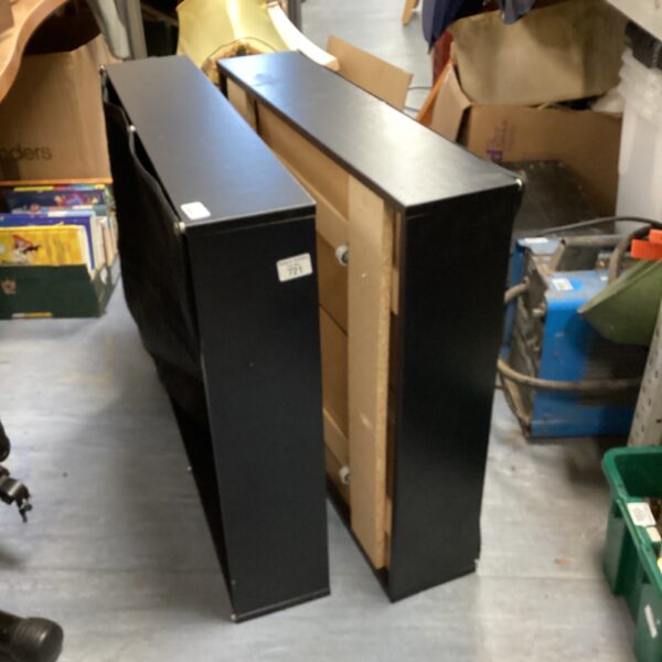 Dark finish wheeled storage boxes for portable organisation.