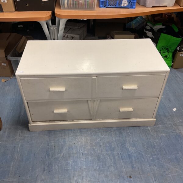 White painted chest of drawers with two drawers for bedroom storage.