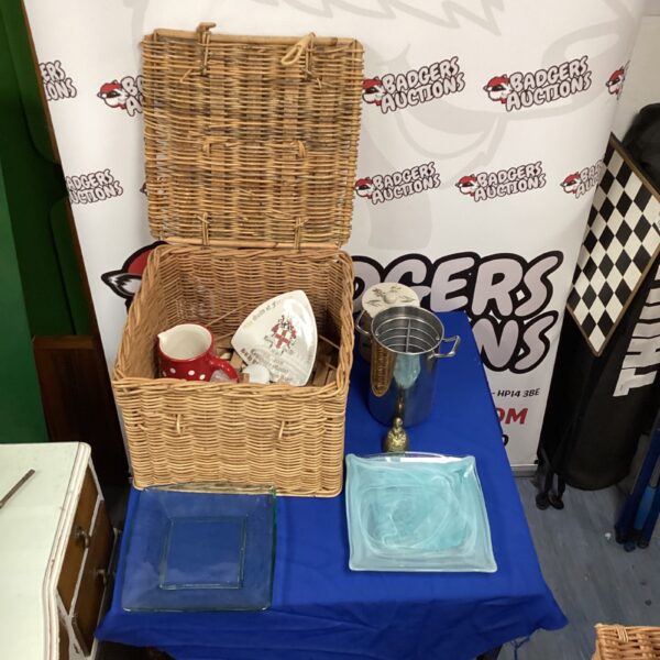 Wicker basket filled with a vintage Dodson commemorative plate and collectibles.