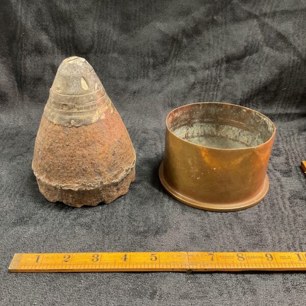 Vintage WWI 4.5in Howitzer shell case dated 1916, a military collectible.