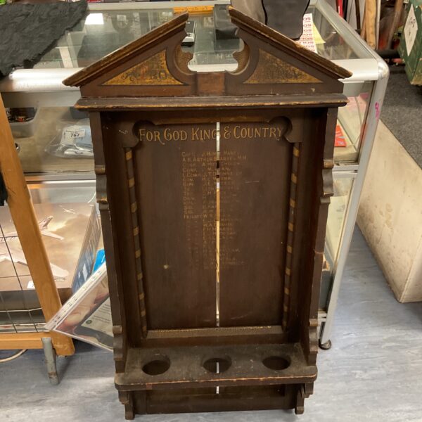 Front view of antique WW1 memorial plaque with inscription.