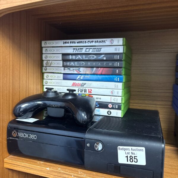 Used Xbox 360 E console with included game titles for sale.