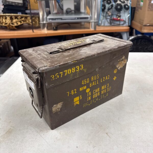Front view of a vintage 7.62mm ammo tin with markings.