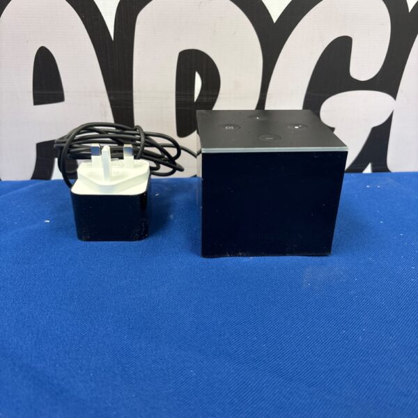 Black Amazon Fire TV Cube streaming device with power cable.