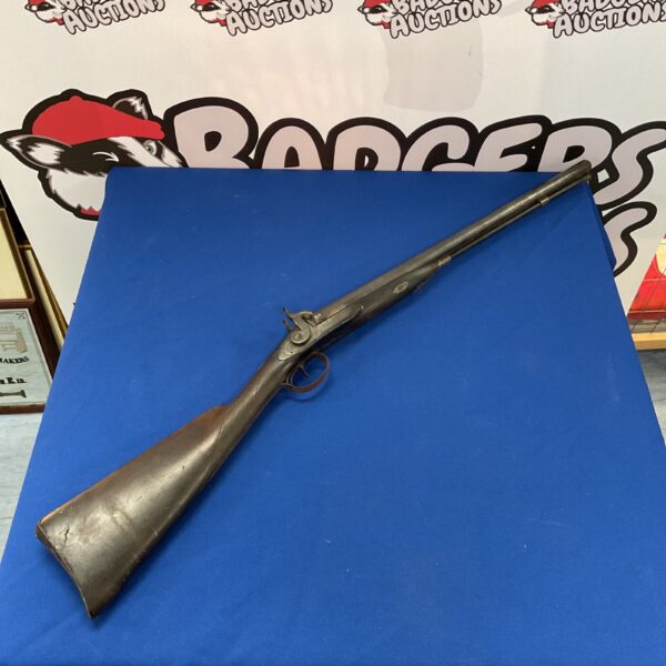 Antique double barrel muzzle loading shotgun, a vintage firearm.