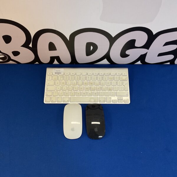 Vintage Apple A1314 keyboard and mouse set for retro computing.