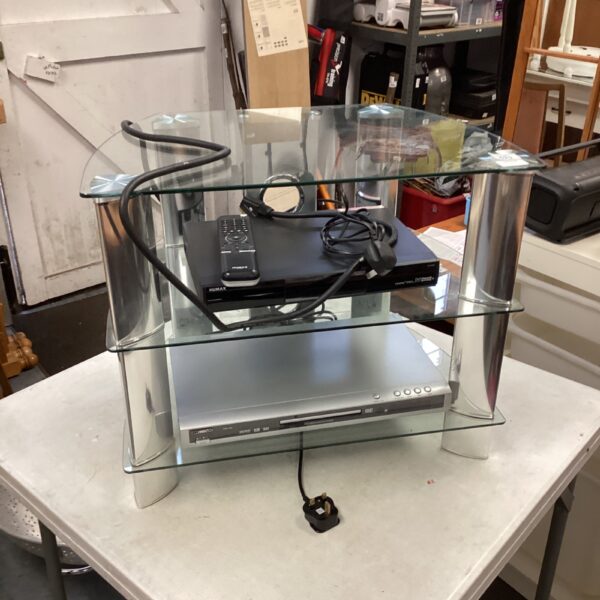 Black glass media stand with Humax and Technique DVD player.