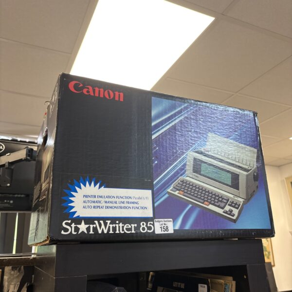 Vintage Canon StarWriter 85 word processor with display and keyboard.