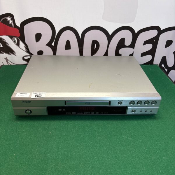 Front view of a vintage Denon DVD player.
