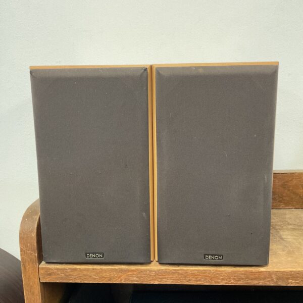 Pair of vintage Denon SC-M50 bookshelf speakers in a home setting.