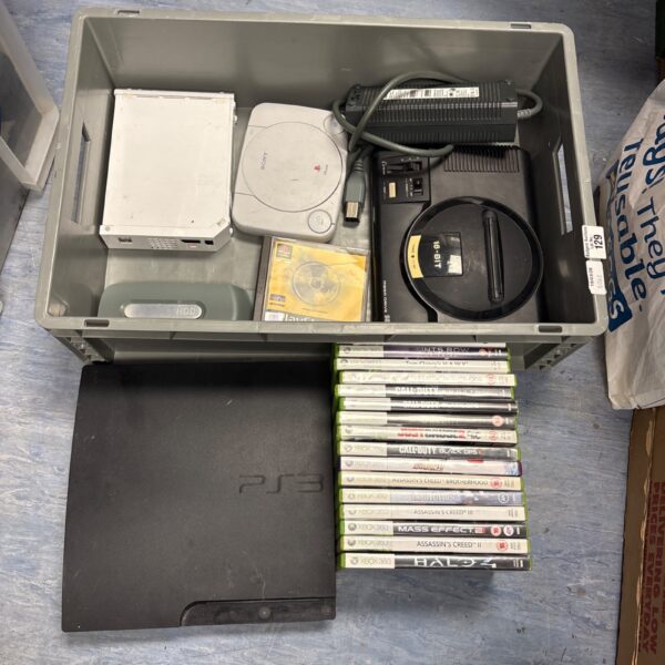 Overview of a gaming console lot with Sega, PlayStation, and Xbox.