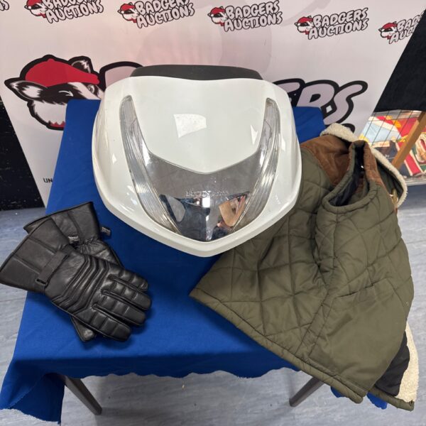 Honda pillion box with gilet and motorcycle gloves.