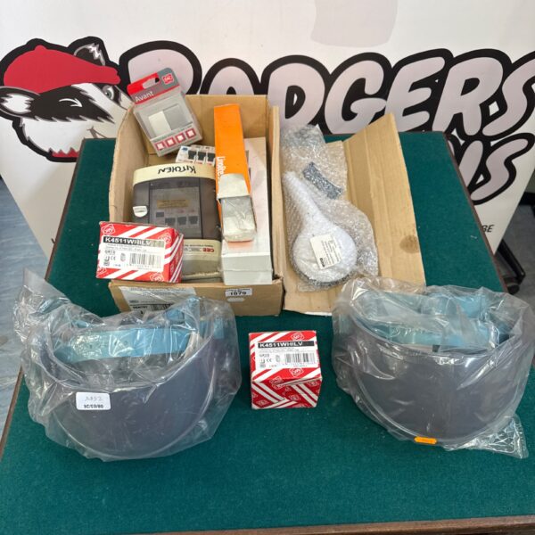 House clearance lot with assorted electrical items and household goods.