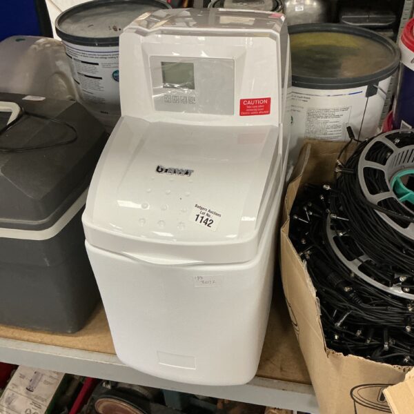 Countertop ice machine appliance for making ice at home.