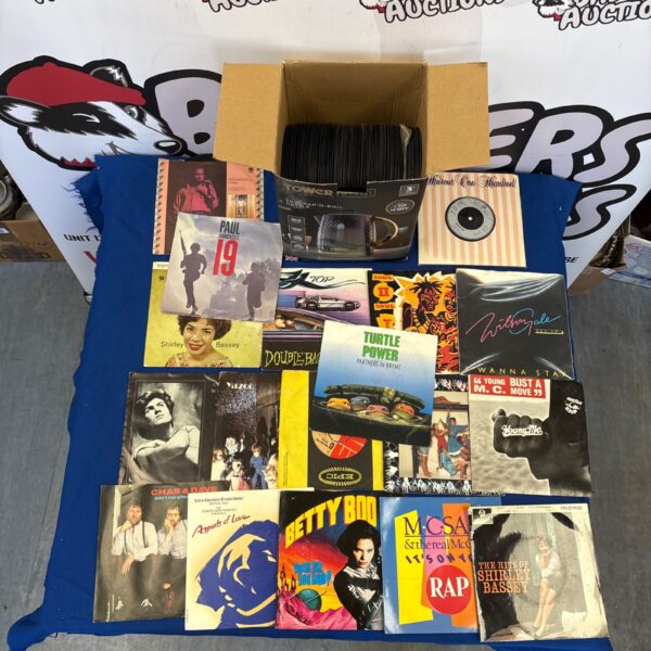 Box of mixed 7” vinyl records