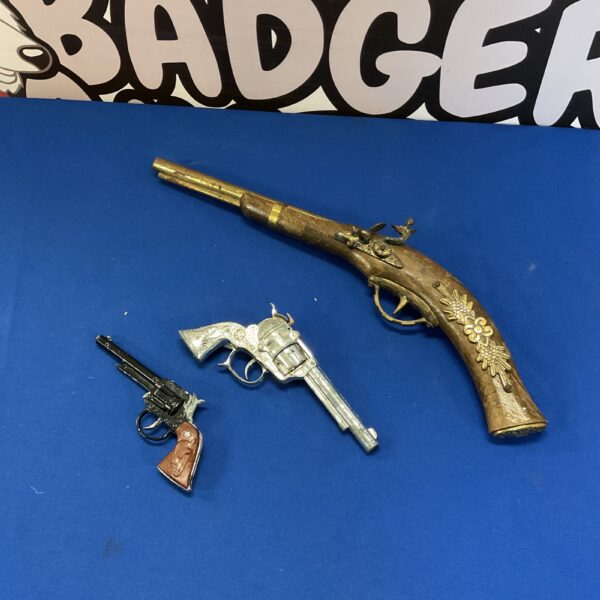 Vintage Lone Star cap guns and flintlock pistol model for collectors.