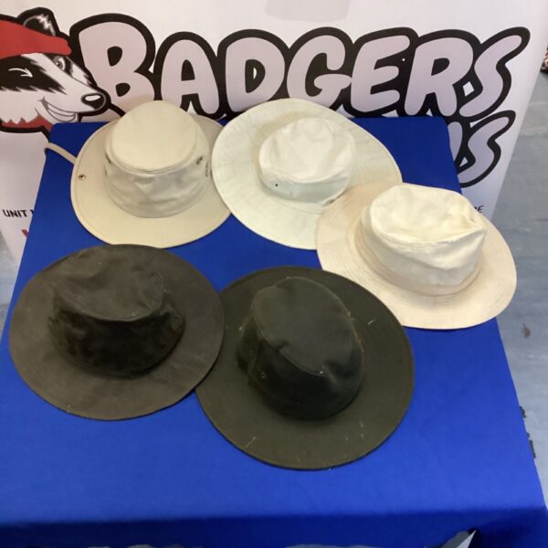 Mixed hats lot including a Tilley hat on display.