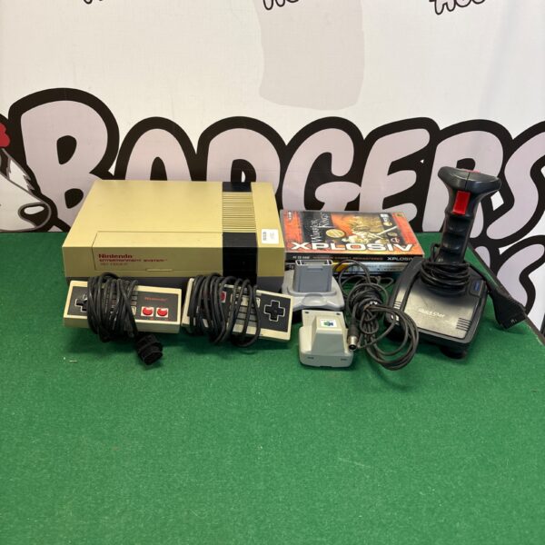 Vintage Nintendo NES console with controllers and N64 accessories.