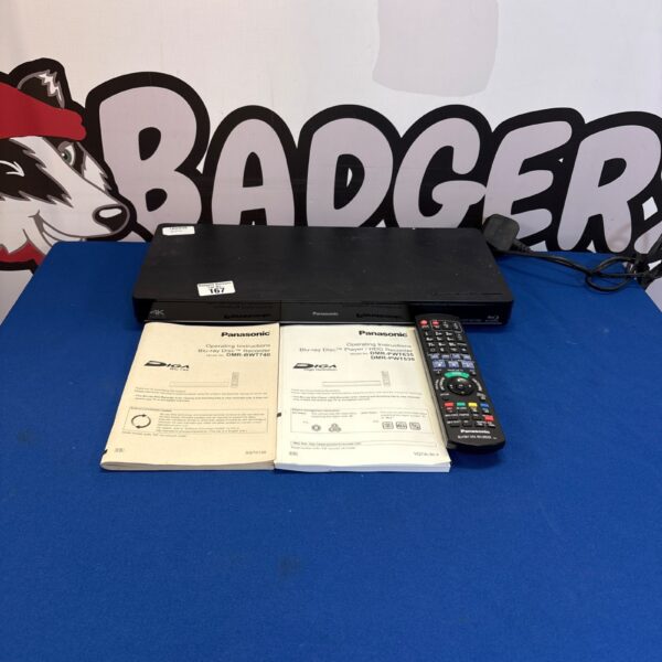 Black Panasonic DMP-BDT380 Blu-ray player with remote and manuals.